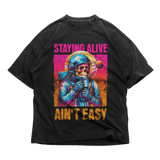 Black 24Heartz T-Shirt featuring "Ain't Easy" graphic design on the front, displayed flat on a white background.