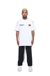 24Heartz t-shirt featuring a Morocco badge design in vibrant colors on a casual tee.
