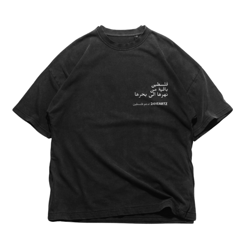 24Heartz Palestine T-Shirt in black featuring a graphic print, displayed on a flat surface.