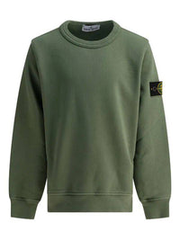 Green sweater from Brandme displayed on a hanger, showcasing its soft texture and relaxed fit.