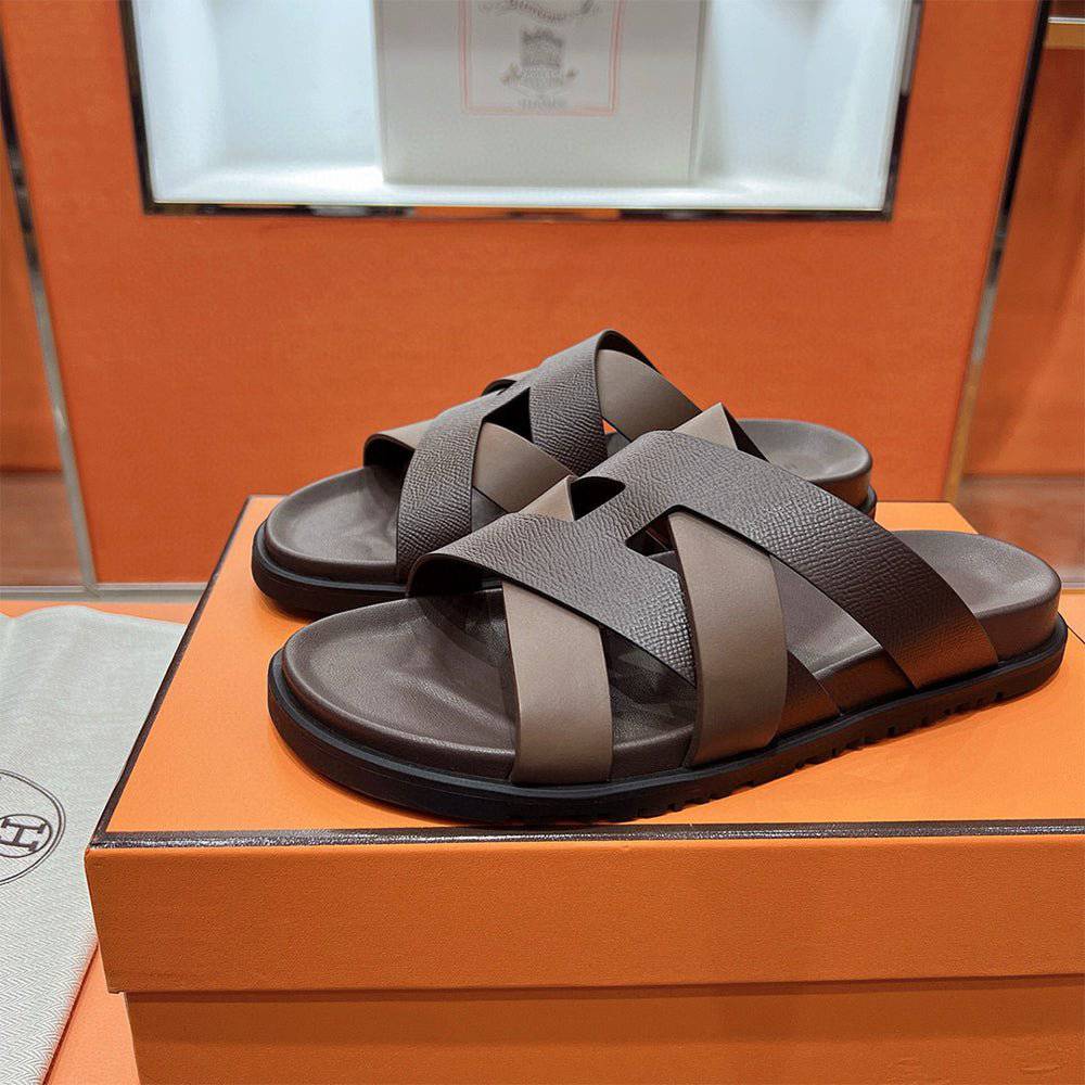 24HEARTZ Kazimir sandal with tan leather straps and flat sole, stylish open-toe footwear for casual summer wear.
