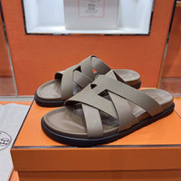 24HEARTZ Kazimir Sandal featuring a stylish open-toe design with braided straps and a comfortable flat sole.