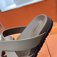 Kazimir Sandal by 24HEARTZ featuring a stylish open-toe design with ankle straps and a comfortable flat sole.