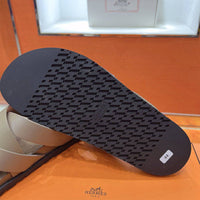 24HEARTZ Kazimir Sandal featuring leather straps and a flat sole, displayed on a neutral background.
