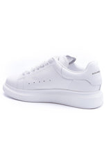 Oversized sneaker by 24HEARTZ featuring a chunky design, soft fabric, and bold color scheme on a white background.