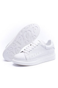 24HEARTZ oversized sneaker in white with chunky sole and minimalistic design, shown from an angled top view.