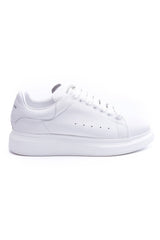 24HEARTZ oversized sneaker in white with chunky sole and lace-up design, displayed from a side angle.