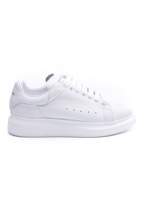 24HEARTZ oversized sneaker in white with chunky sole and lace-up design, displayed from a side angle.